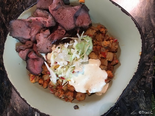 Satu'li bowl with beef, potato hash, and creamy herb dressing