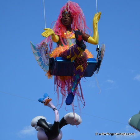 Aerialist Swing High Above the Crowd