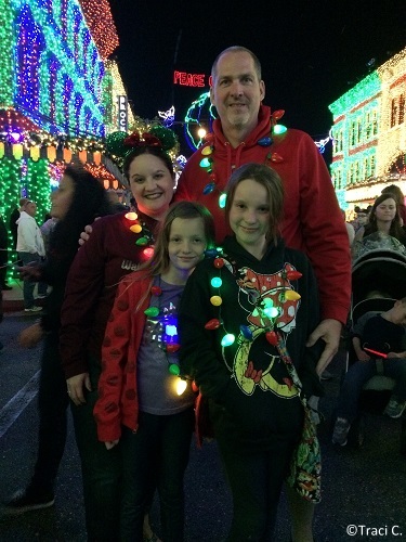 Light up necklaces and festive ear hats are a must!