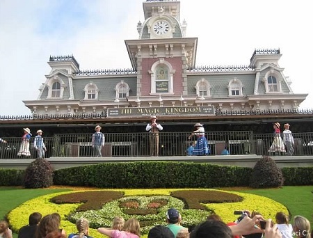 Citizens of Main Street welcome guests to the Magic Kingdom