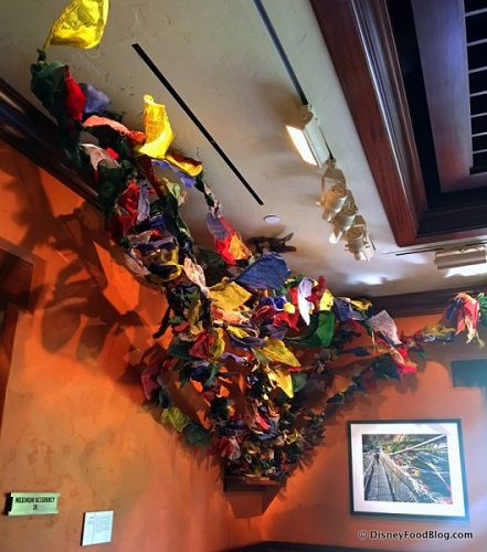 A prayer flag display in a gallery at Tiffins