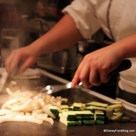 Chef preparing vegetables on the cooktop